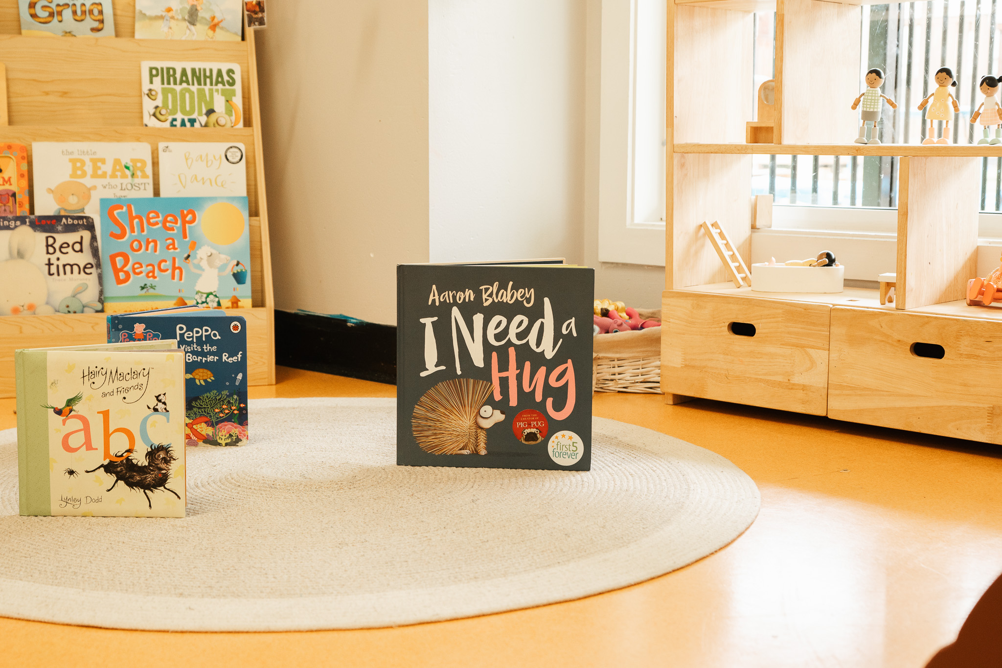Picture books and wooden toys in a welcoming reading corner