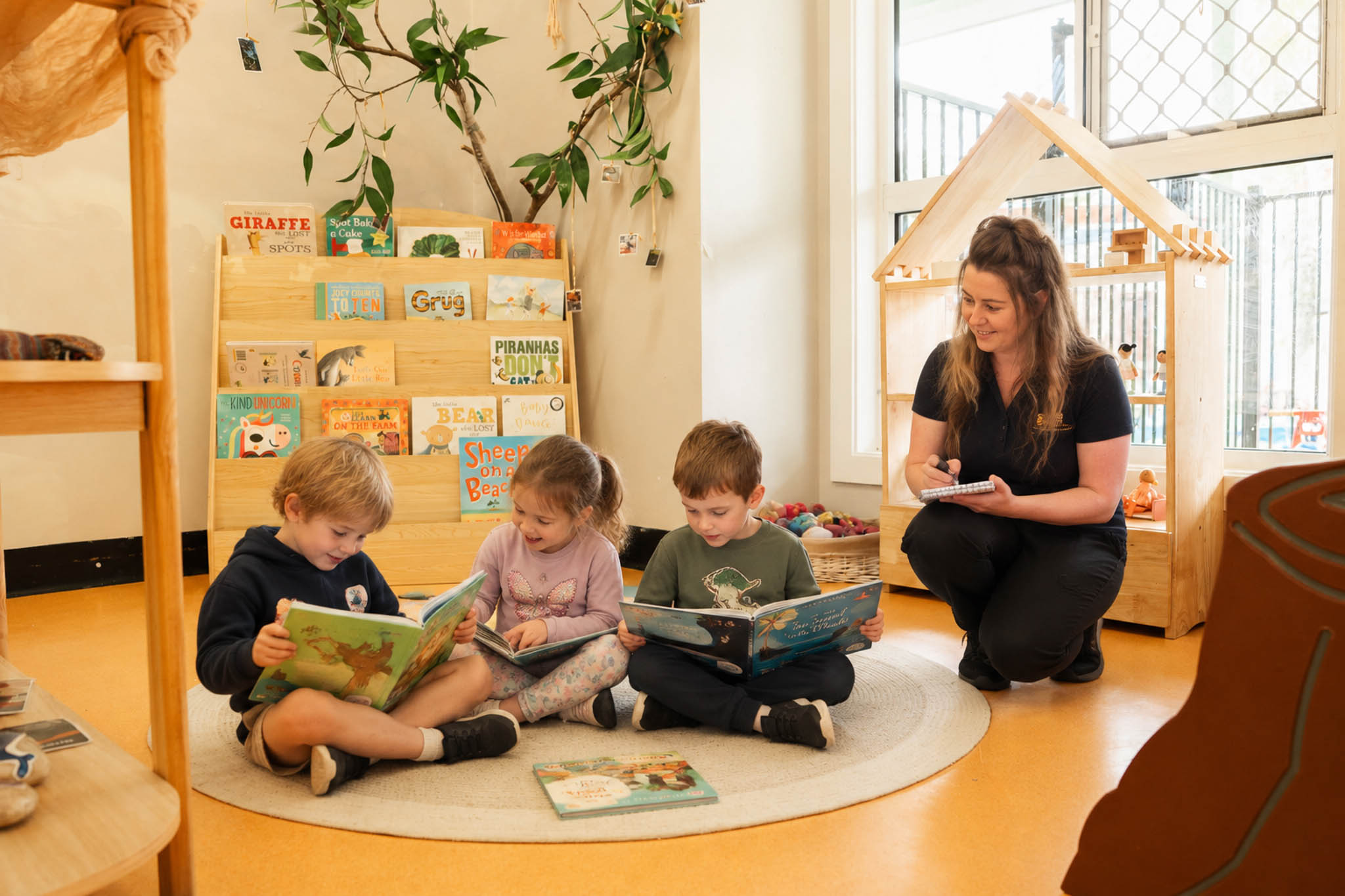 An educator helping children discover