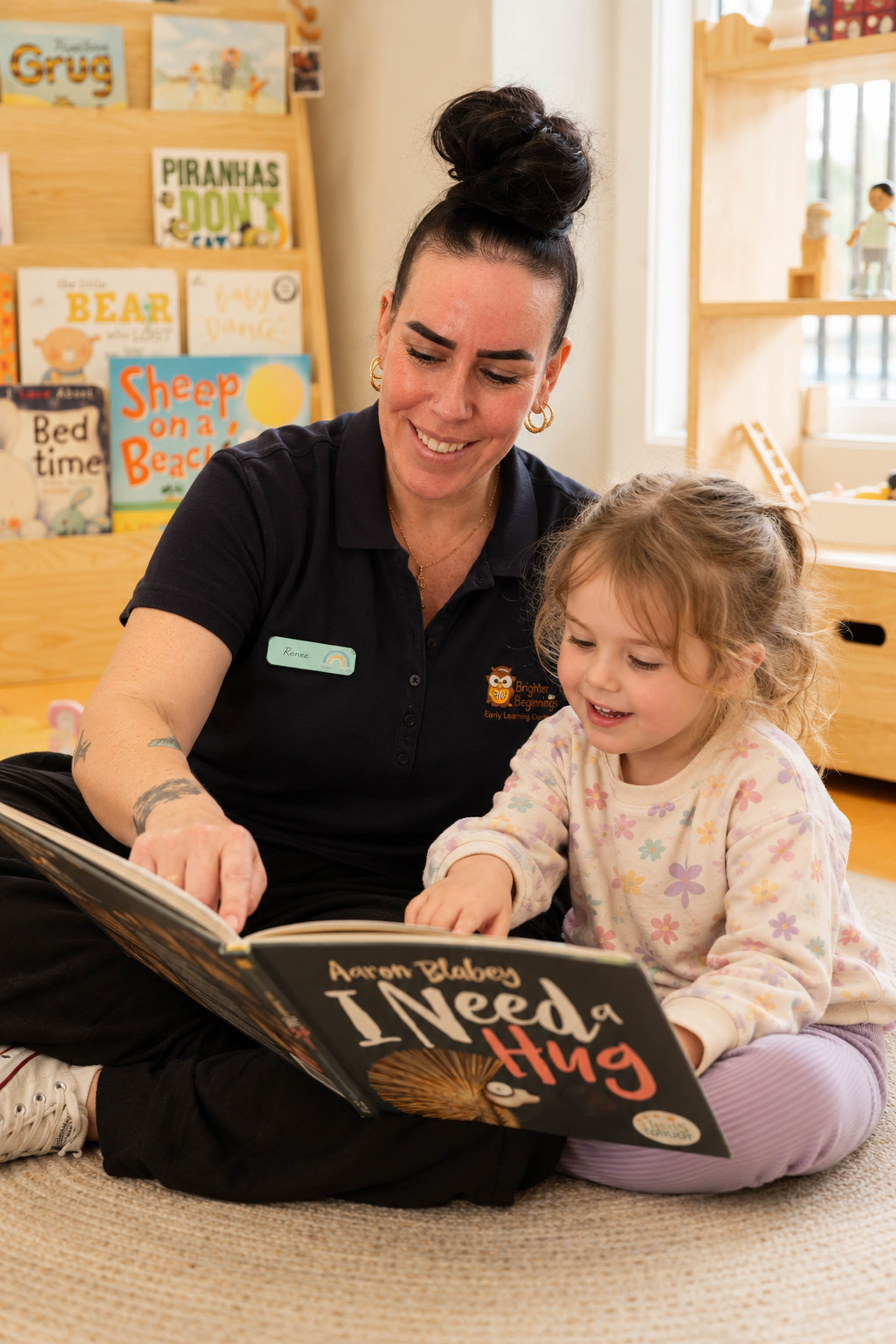 An educator sharing a picture book with a child
