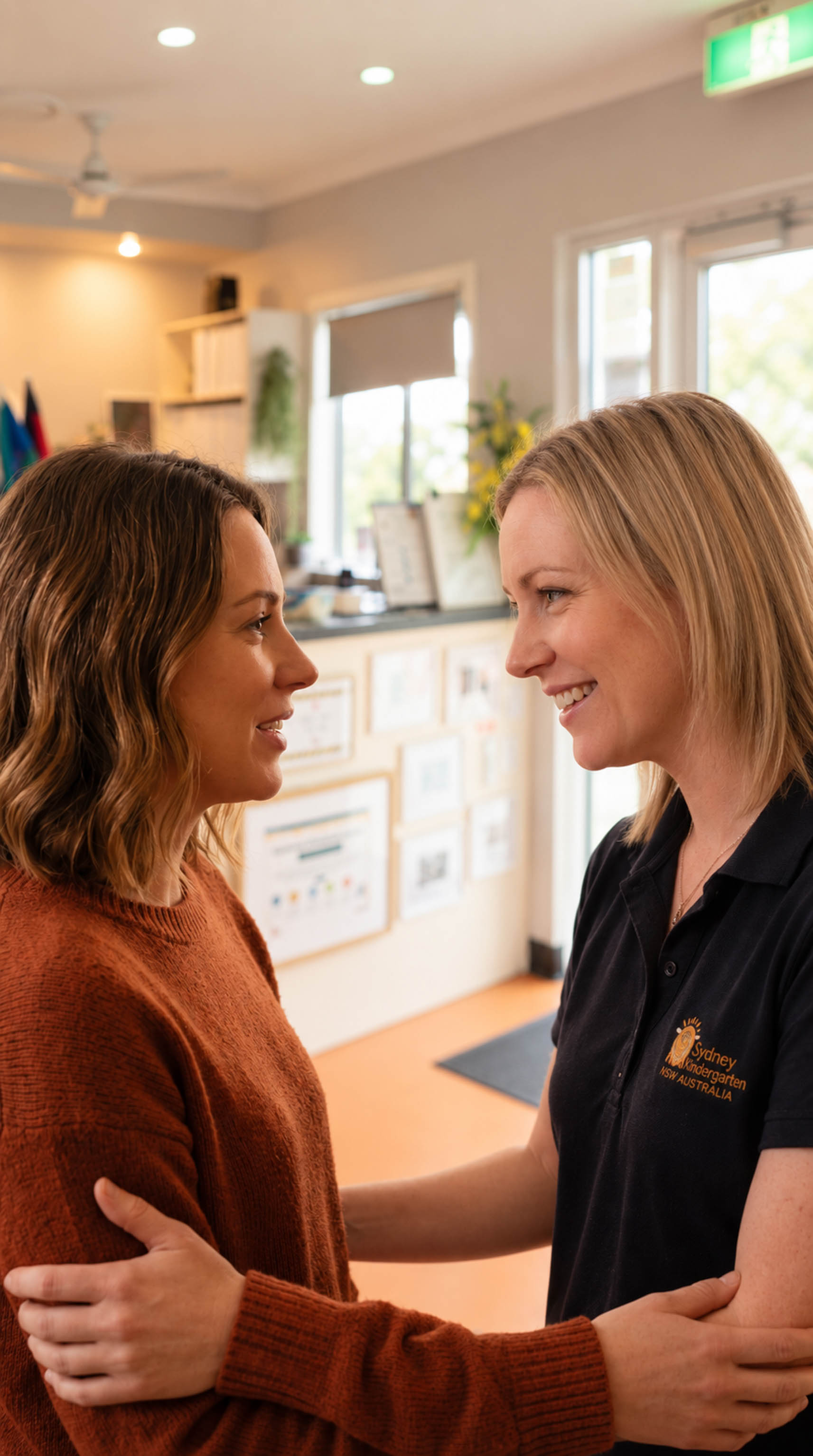 A parent and educator talking together at the centre